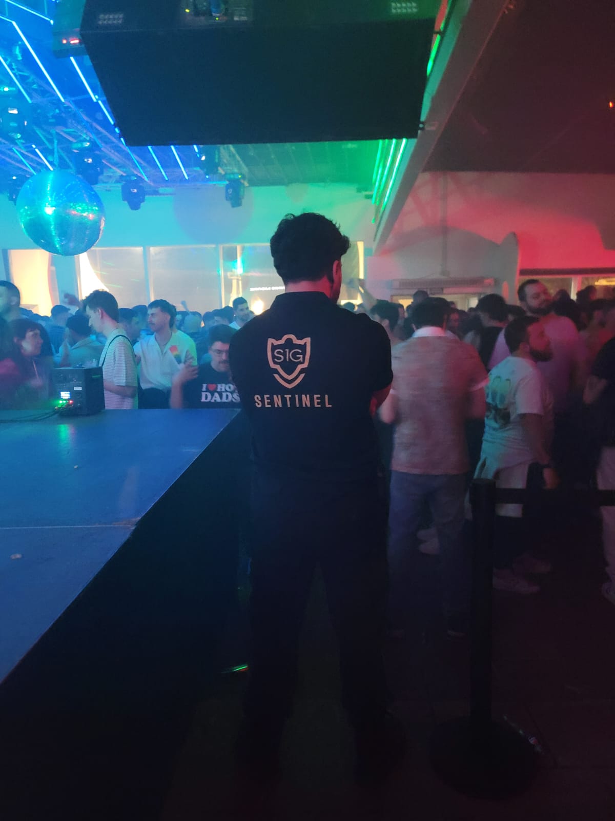 Security professional in suit monitoring corporate environment